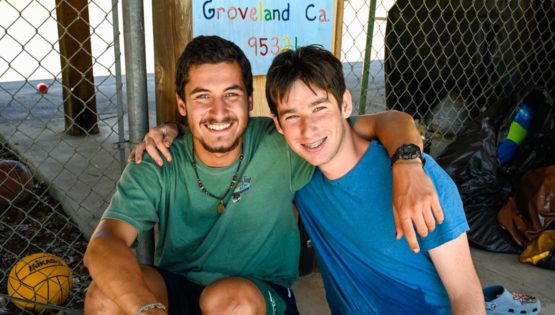 Staff and camper smiling