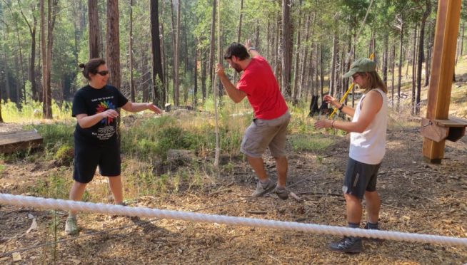 Alumni on the low ropes course