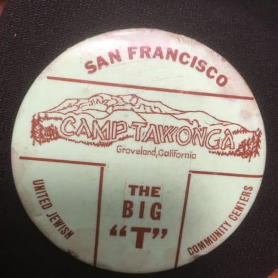 Tawonga button with "The Big 'T'" written on it