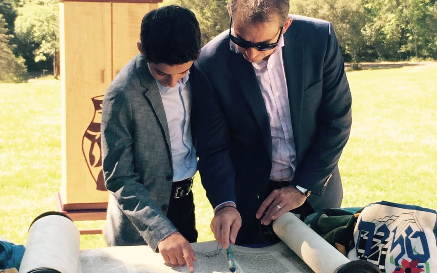 Boy and staff reading the Torah at a bar mitzvah