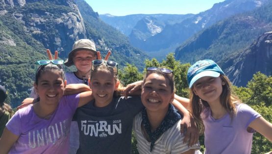 Hikers by mountains on the Taste of Quest