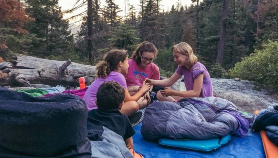 Campers on Taste of Quest in sleeping bags