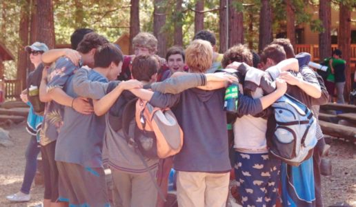 Boys giving each other a group hug