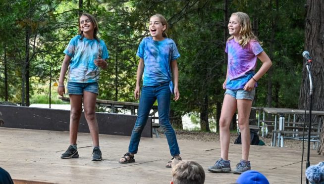 Girls on stage singing