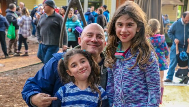 Dad and daughters at family camp