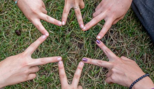 Kids making Star of David from hands
