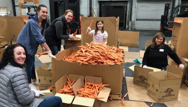 Family volunteering at a food bank